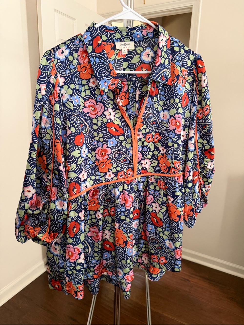 Umgee Navy Floral Split V-Neck Babydoll Top with Orange Trim